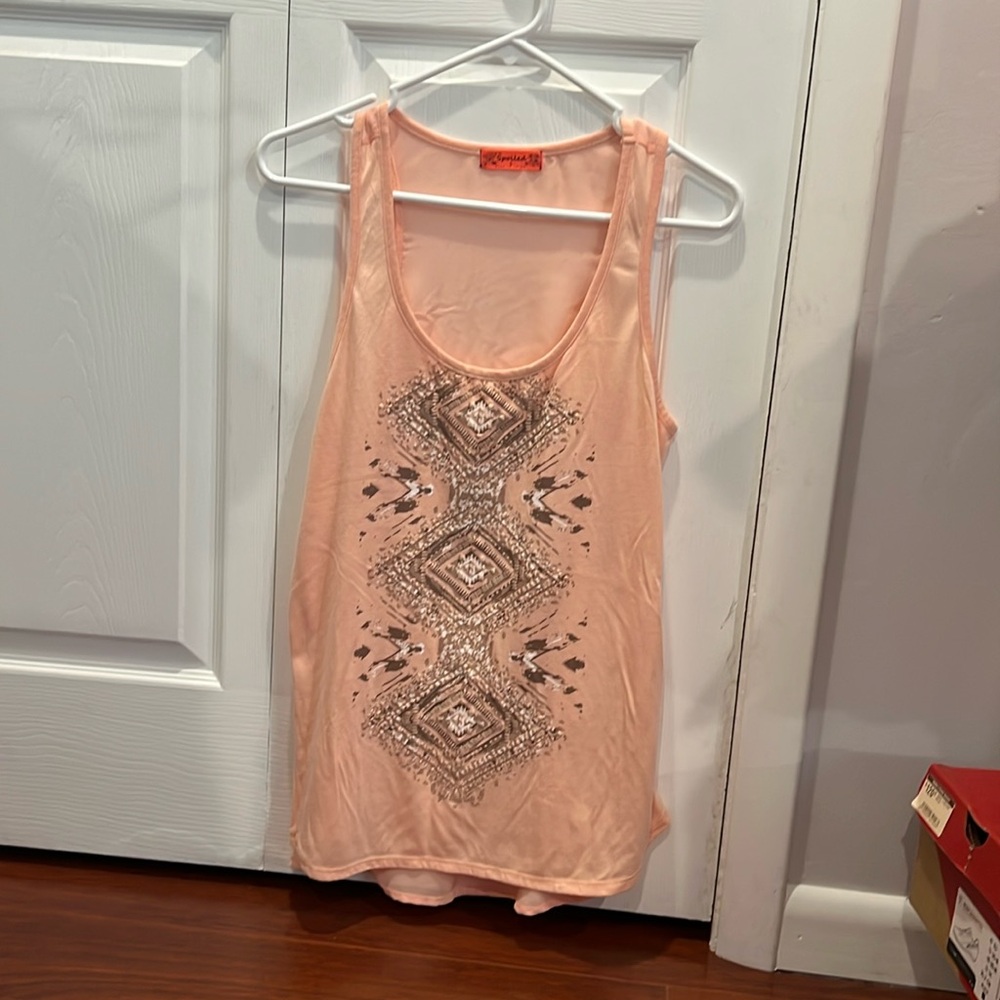 Women tank. Pink/peach color. See through back